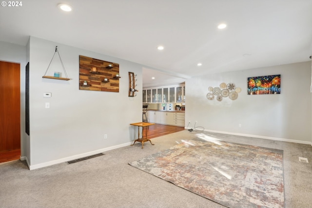 unfurnished living room featuring carpet flooring