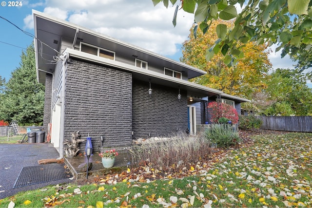 view of side of property featuring a patio area