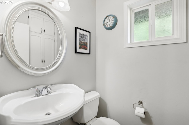 bathroom featuring sink and toilet