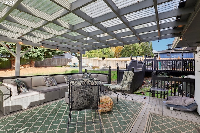 wooden deck featuring a pergola and an outdoor hangout area