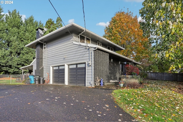 view of property exterior with a garage