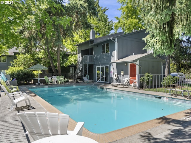 view of swimming pool with a patio