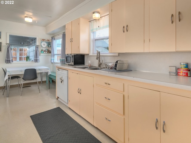 kitchen featuring dishwasher and tasteful backsplash