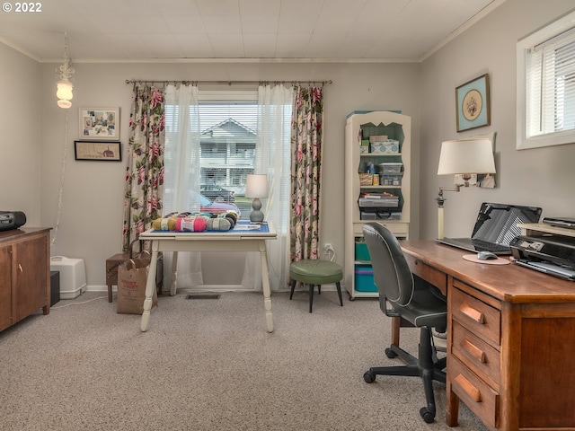 office space with crown molding and light carpet