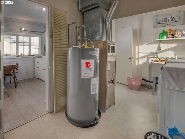 utility room featuring washer / clothes dryer and water heater