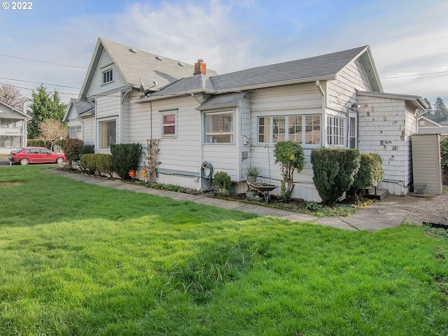 exterior space featuring a front lawn