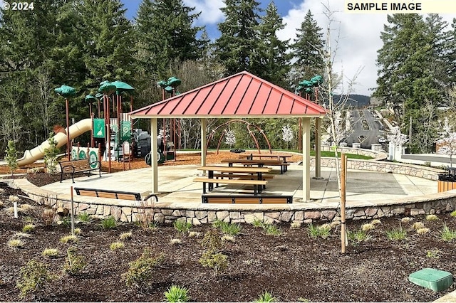 view of community featuring a playground and a gazebo