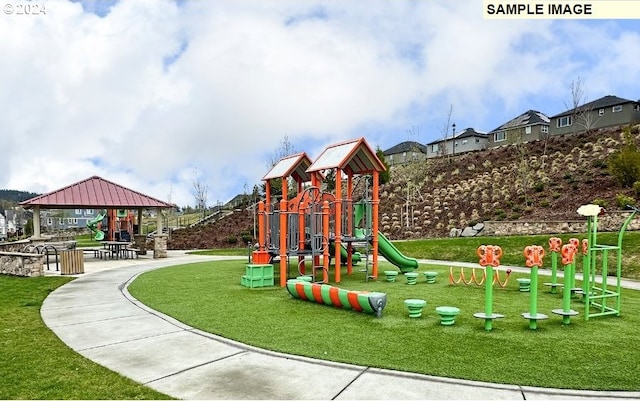 view of jungle gym featuring a gazebo and a yard