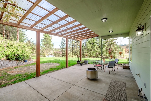 view of patio with an outdoor fire pit and a pergola