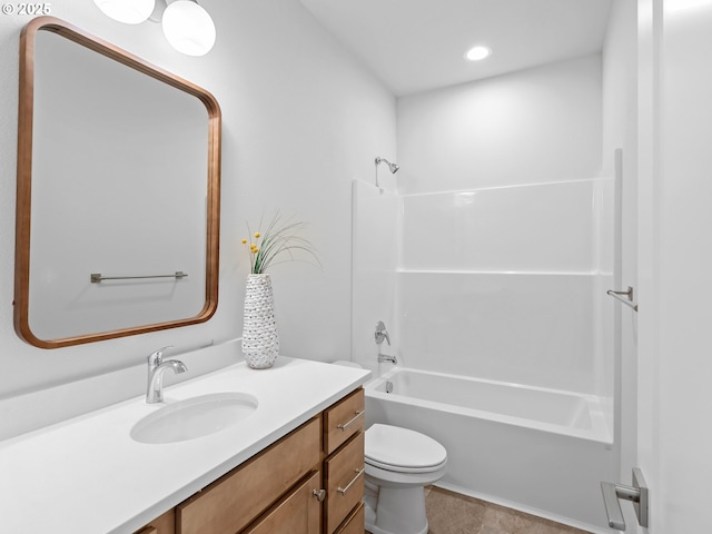 bathroom featuring washtub / shower combination, vanity, toilet, and recessed lighting