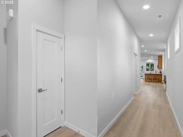 corridor featuring light hardwood / wood-style flooring