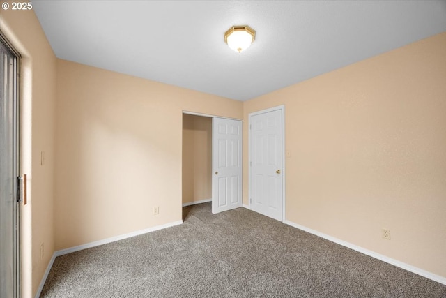 unfurnished bedroom with carpet floors and a closet