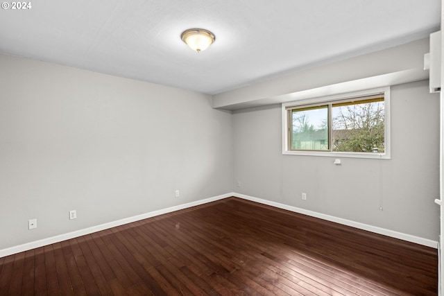 empty room with hardwood / wood-style floors