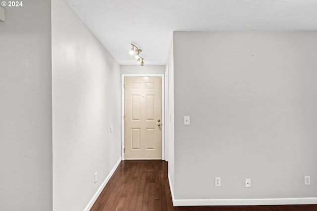 hall with dark hardwood / wood-style floors