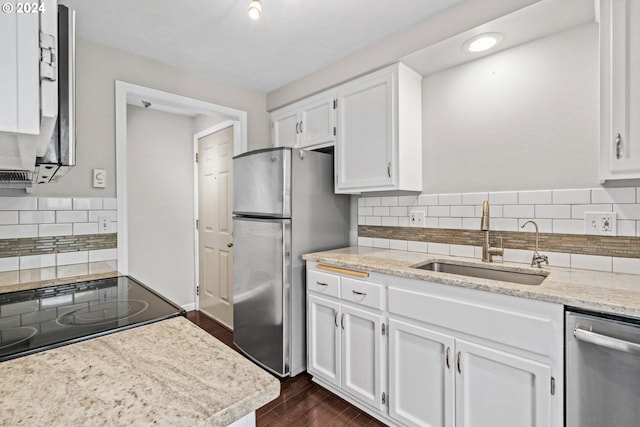 kitchen with backsplash, sink, white cabinetry, and appliances with stainless steel finishes