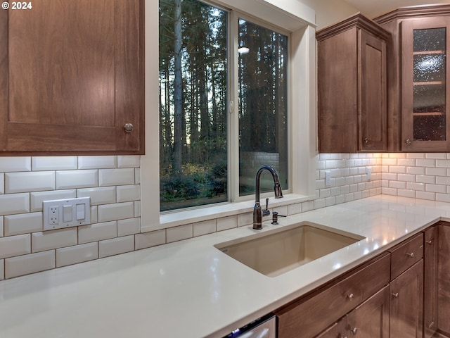 kitchen with backsplash and sink