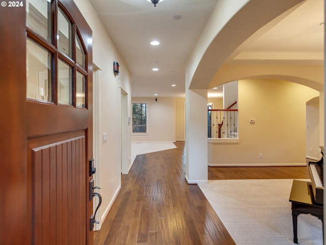 hallway with dark hardwood / wood-style floors