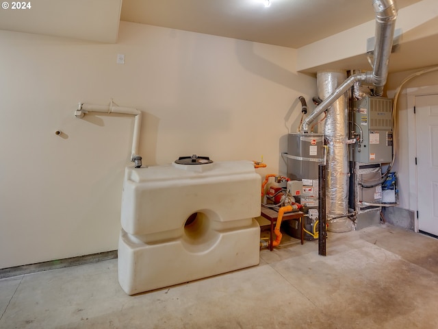 utility room with heating unit and strapped water heater