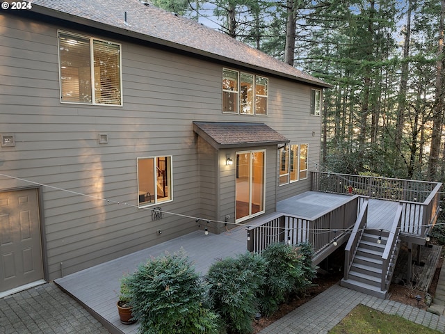 rear view of property with a wooden deck