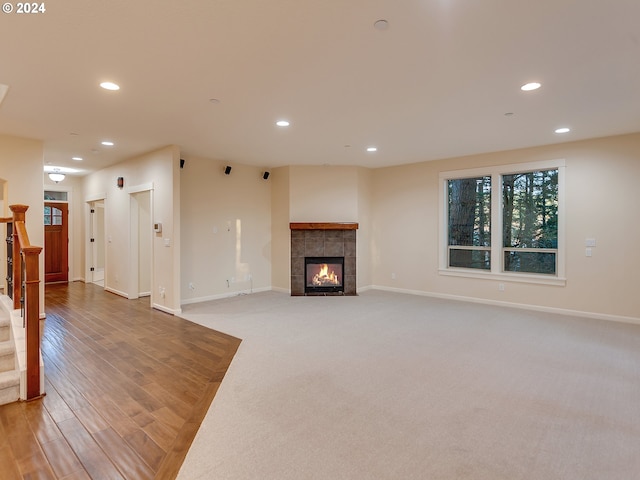 living room featuring a fireplace and wood-type flooring