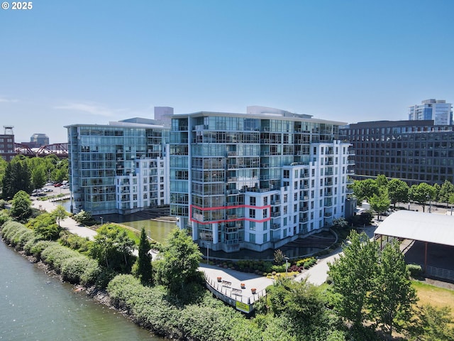 view of building exterior with a water view