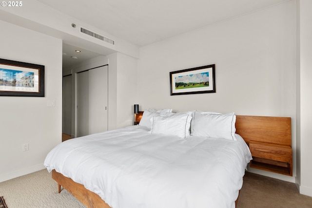 carpeted bedroom with a closet