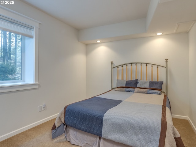 carpeted bedroom featuring recessed lighting and baseboards