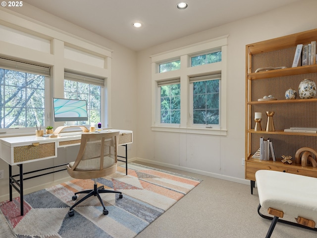 carpeted office space with recessed lighting, plenty of natural light, and baseboards