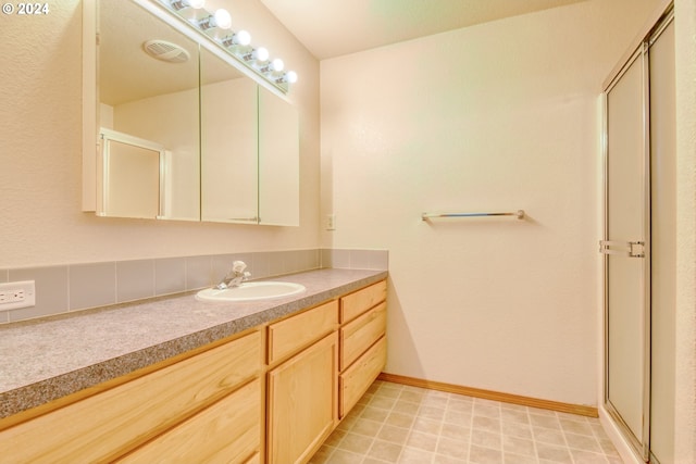 bathroom featuring vanity and walk in shower