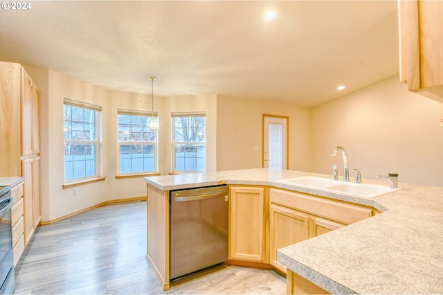 kitchen featuring sink, light brown cabinets, hanging light fixtures, light hardwood / wood-style flooring, and appliances with stainless steel finishes