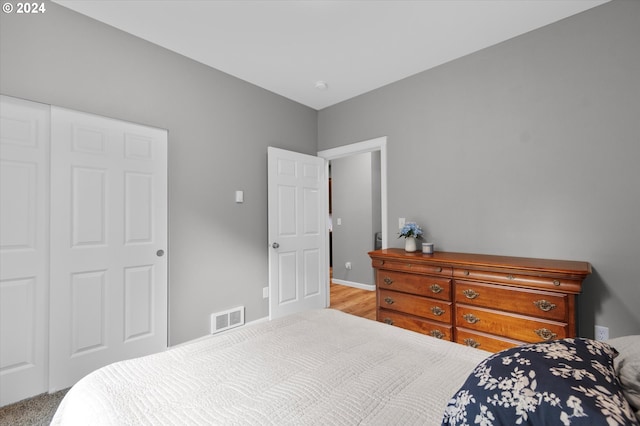 bedroom featuring visible vents and baseboards