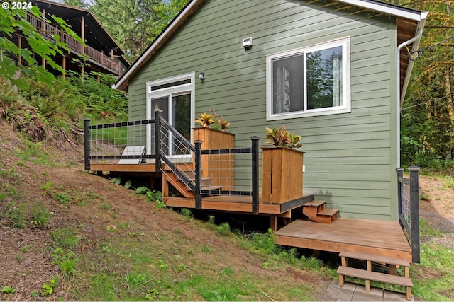 rear view of house with a deck