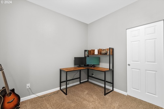 carpeted office featuring baseboards