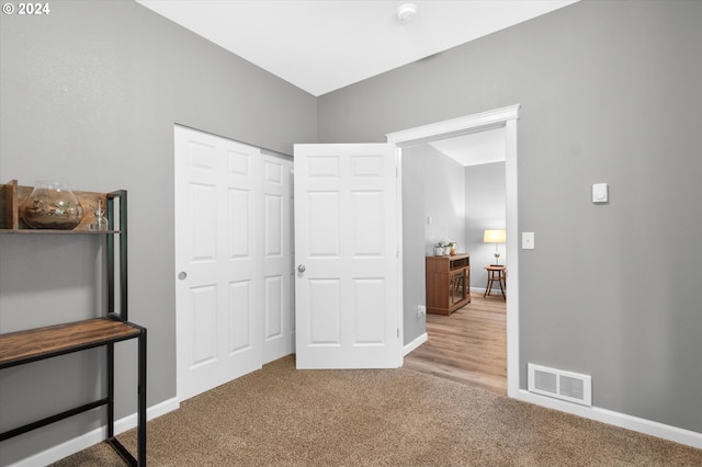 bedroom with carpet flooring and a closet