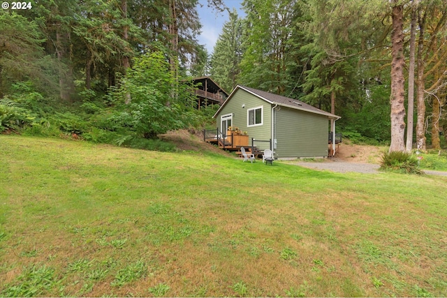 view of yard featuring a wooden deck