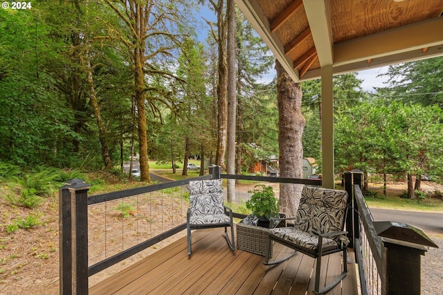 wooden terrace featuring covered porch