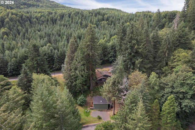 birds eye view of property featuring a wooded view