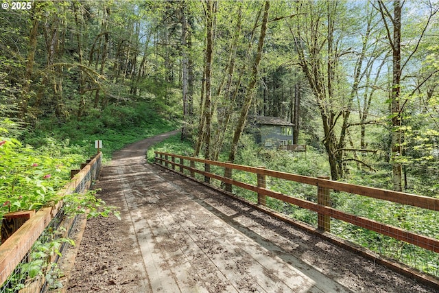 view of home's community featuring a forest view