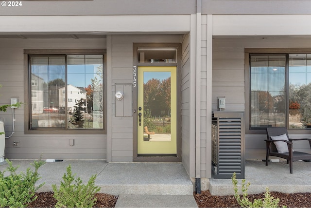 view of exterior entry featuring a porch