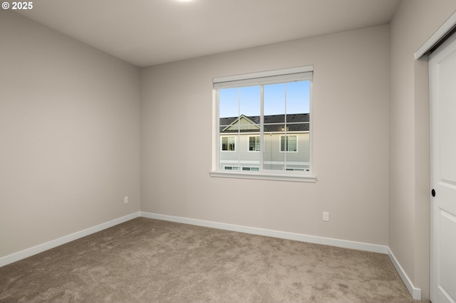 unfurnished bedroom with baseboards and carpet floors