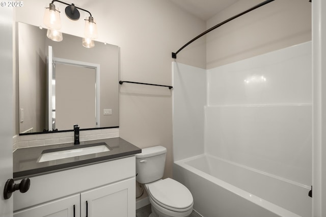 full bath featuring vanity, toilet, and shower / bathtub combination