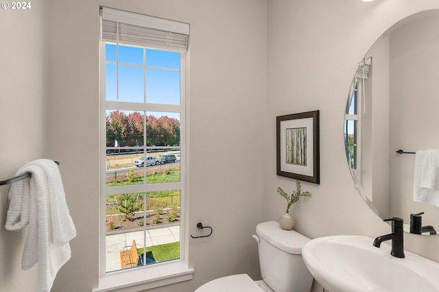 bathroom featuring sink and toilet