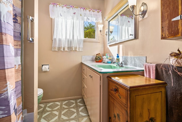 bathroom with vanity, a shower with curtain, and toilet