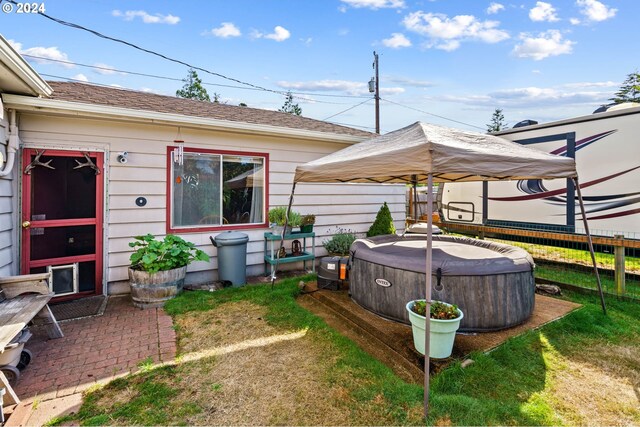 view of yard featuring a gazebo and a hot tub