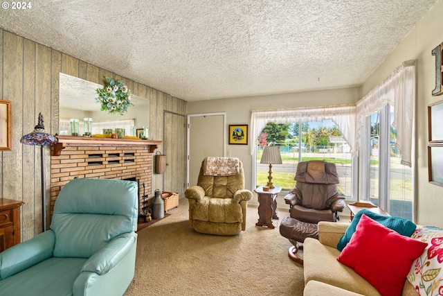 carpeted living room featuring a fireplace, a textured ceiling, and wood walls