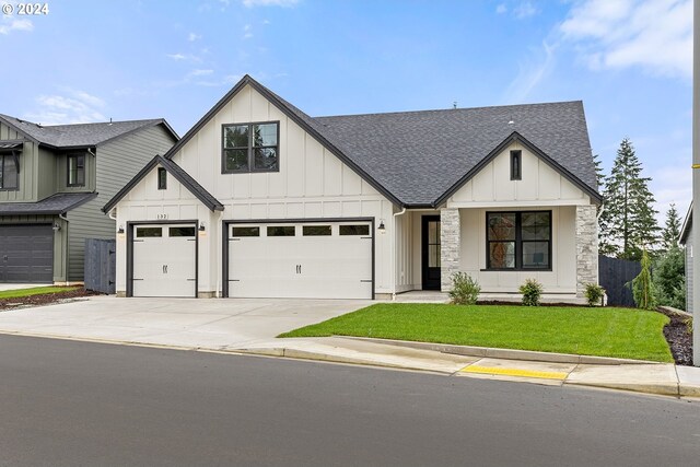 modern farmhouse style home with a front lawn