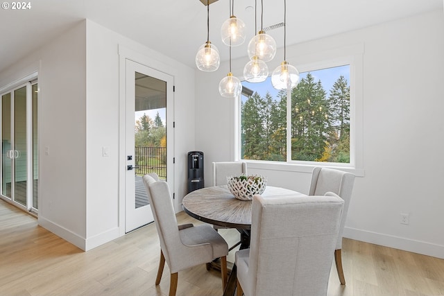 dining area featuring light wood-type flooring