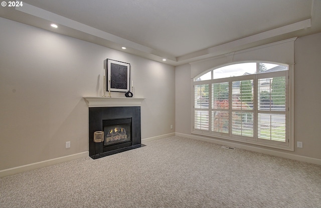 unfurnished living room featuring carpet flooring