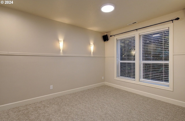 unfurnished room featuring carpet floors