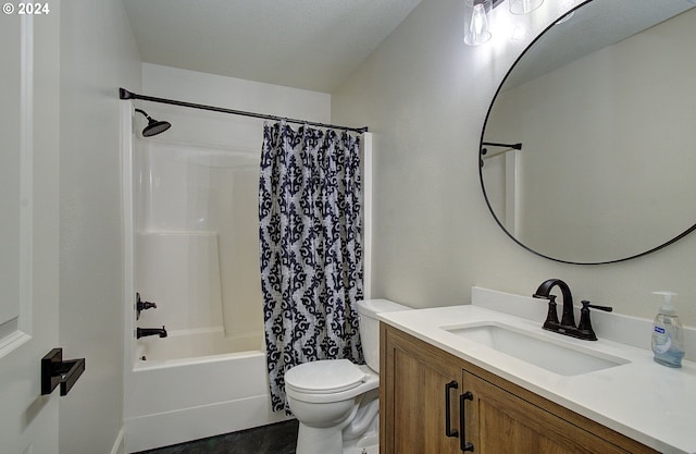 full bathroom featuring shower / bath combination with curtain, vanity, a textured ceiling, and toilet